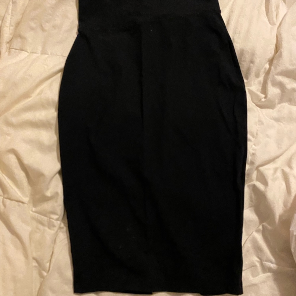 Black knee length pencil skirt with small split in the back
